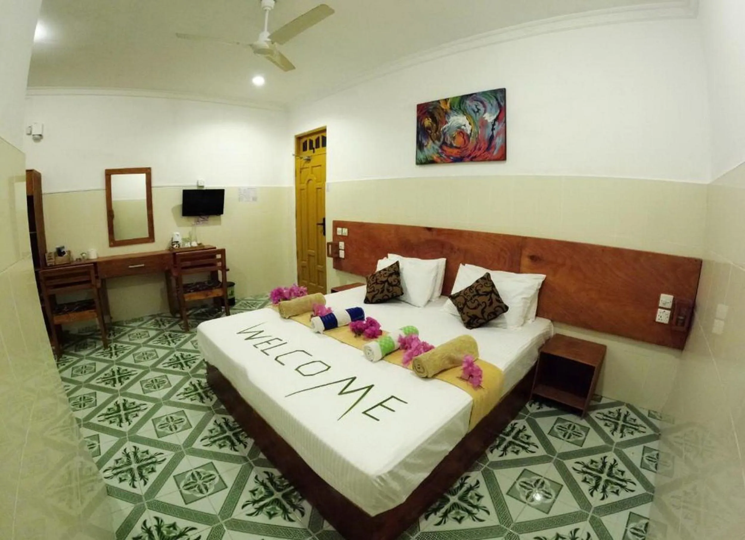 Bed in Adroit Beach Inn