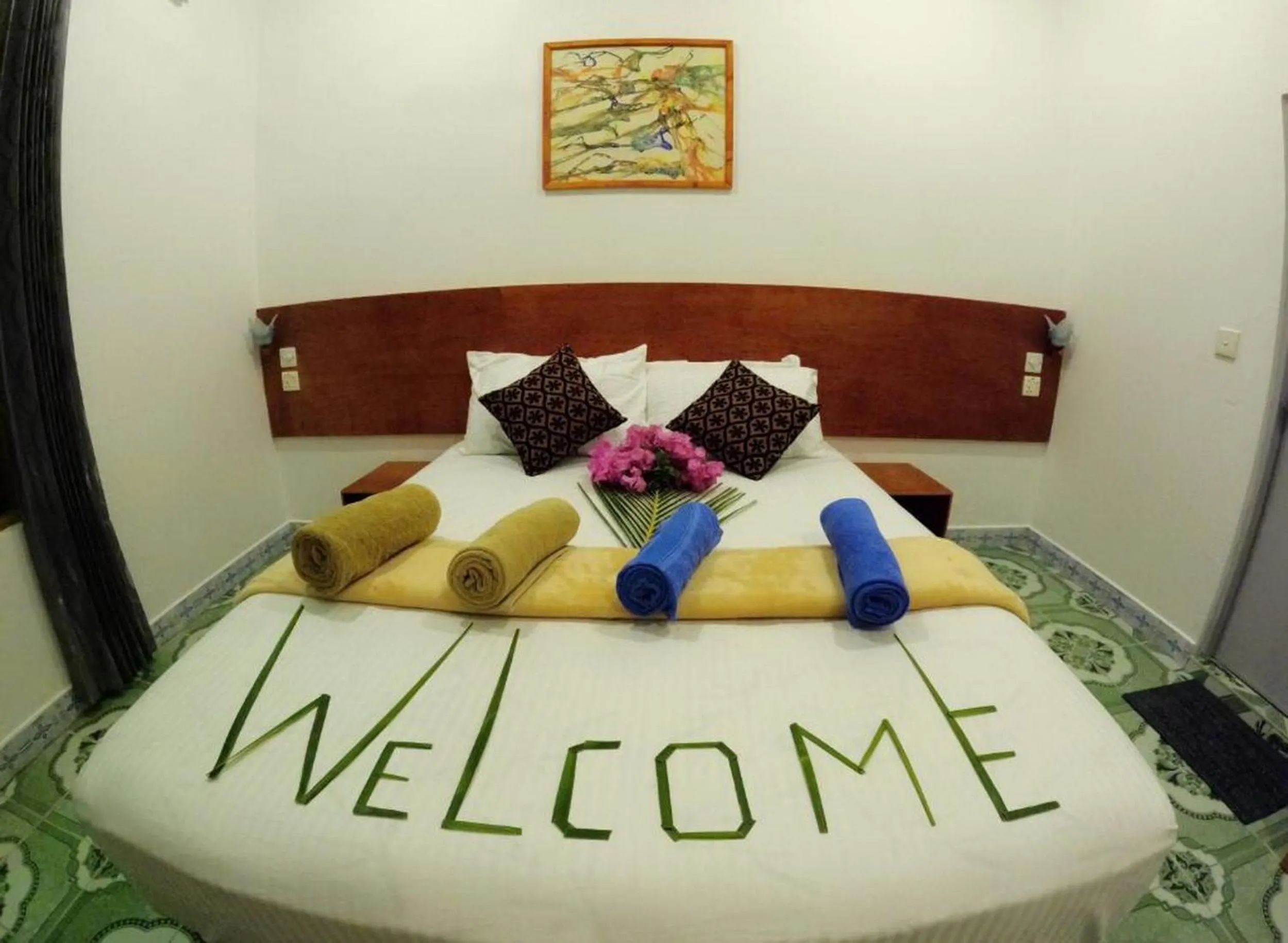 Bed in Adroit Beach Inn