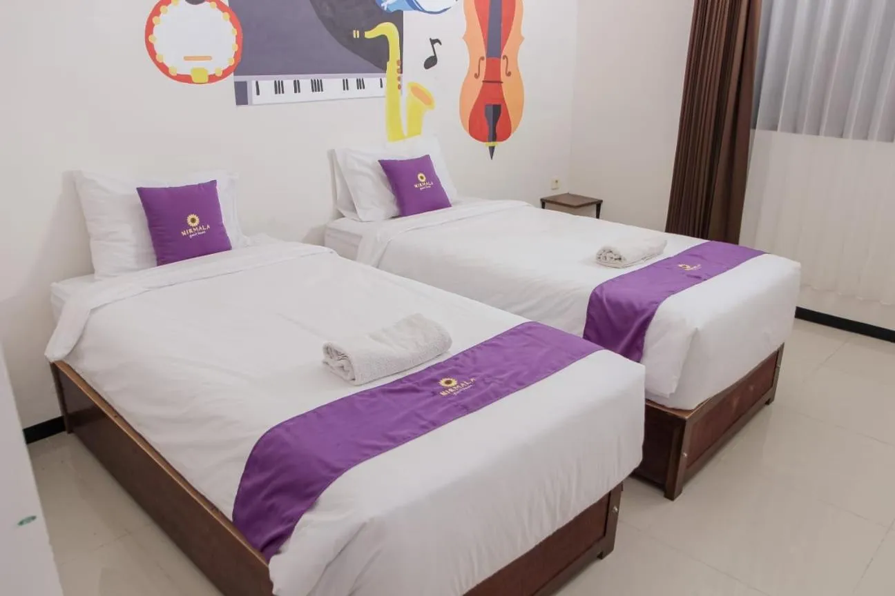 Bed in Votel Nirmala Hotel Malang