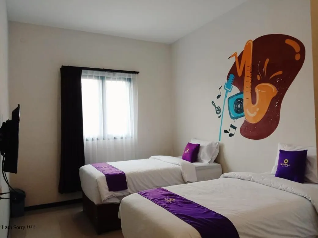 Bed in Votel Nirmala Hotel Malang