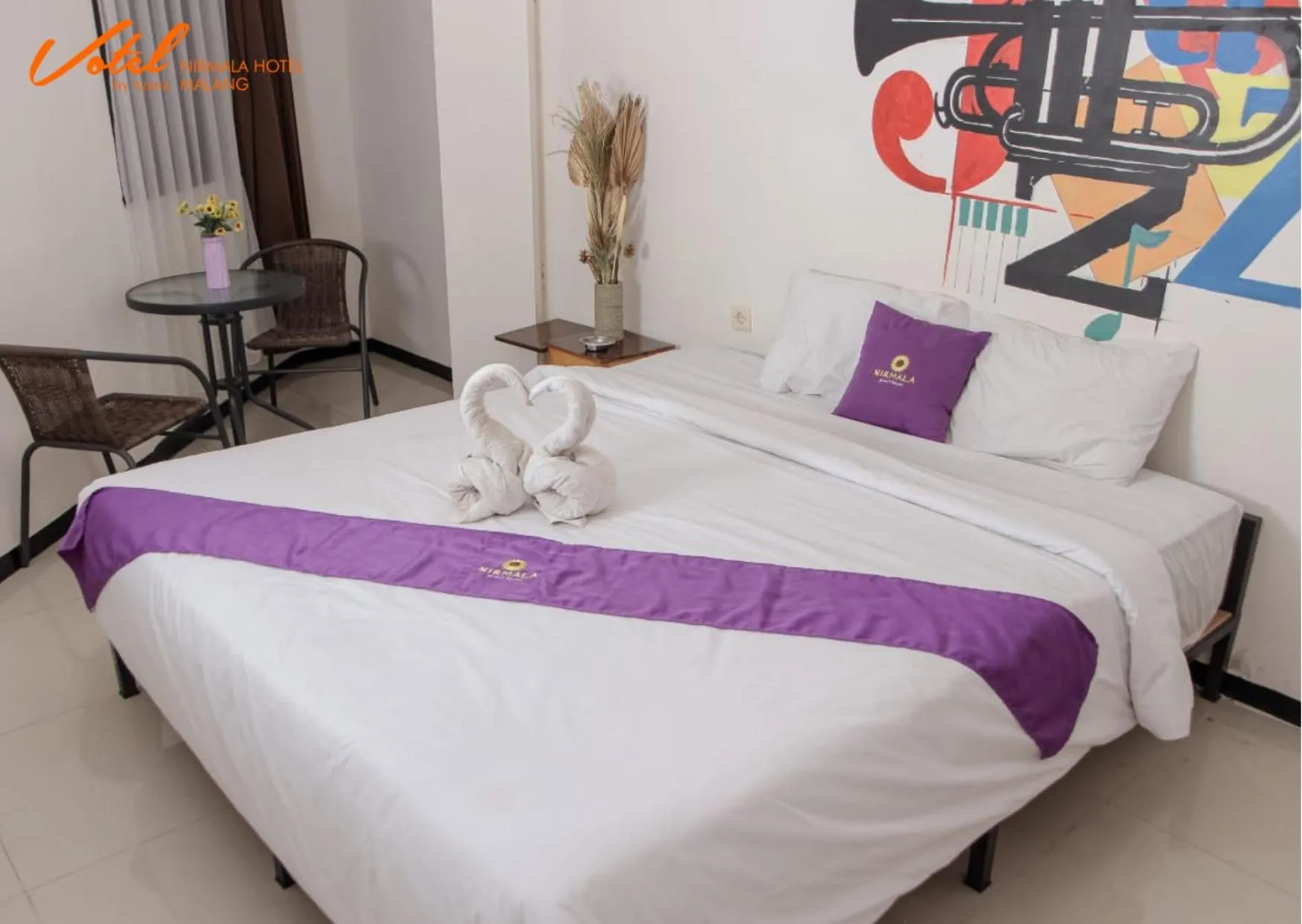 Bed in Votel Nirmala Hotel Malang