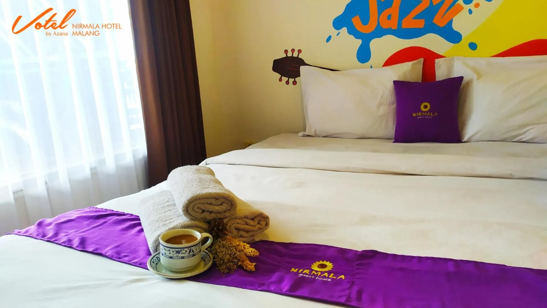 Bed in Votel Nirmala Hotel Malang