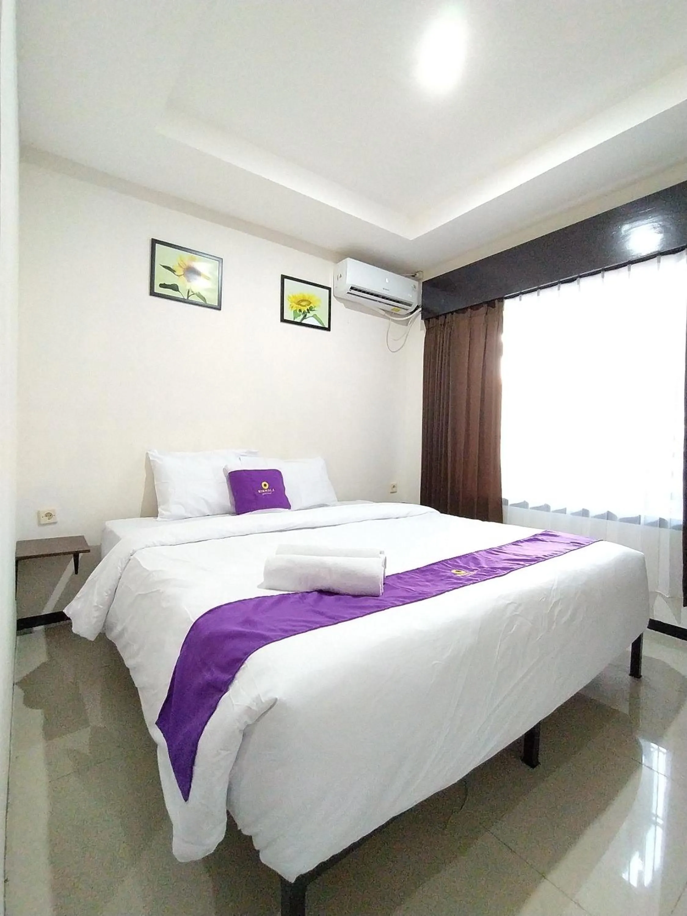 Bed in Votel Nirmala Hotel Malang