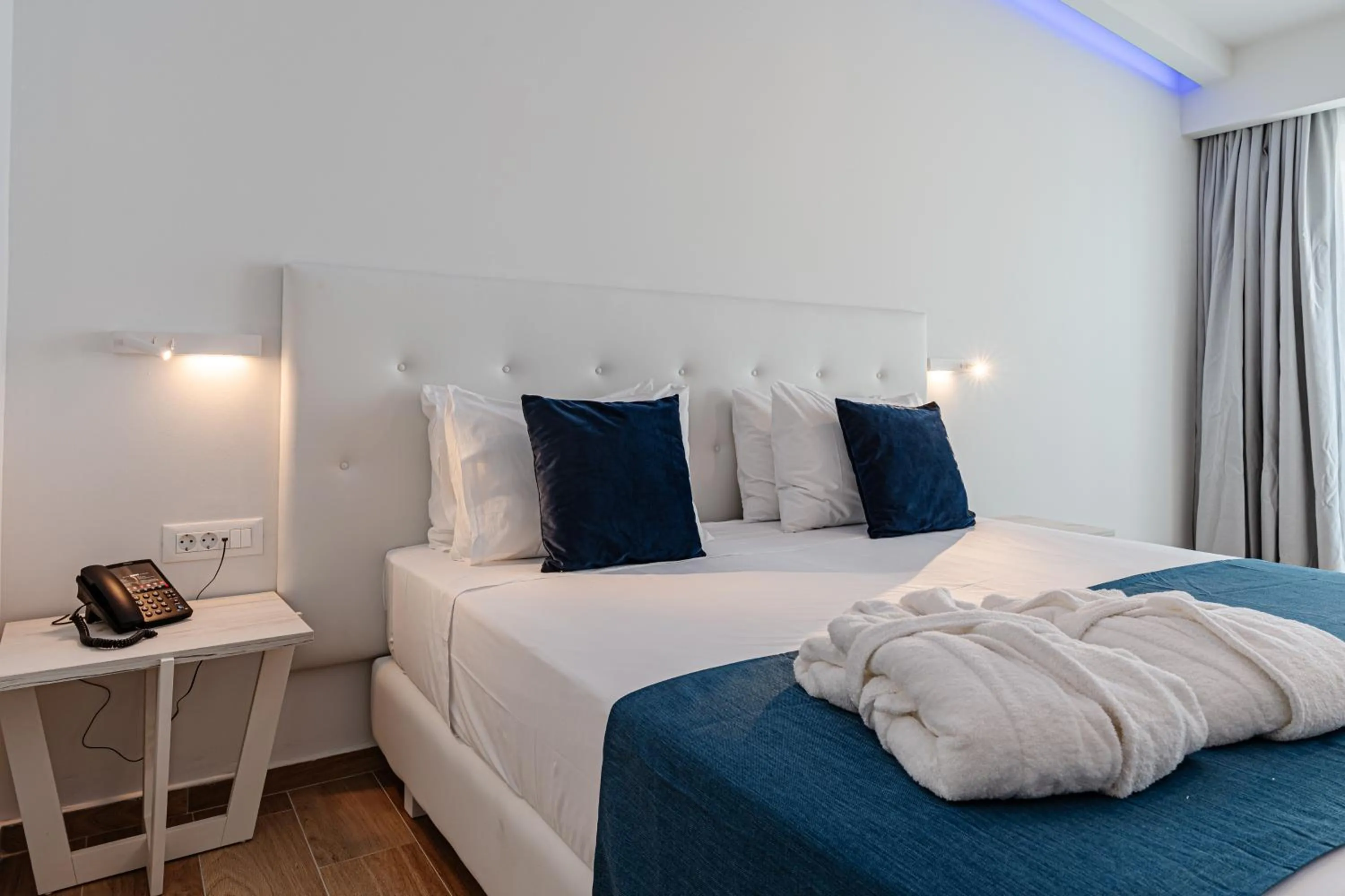 Bed in Magique Bleu Suites