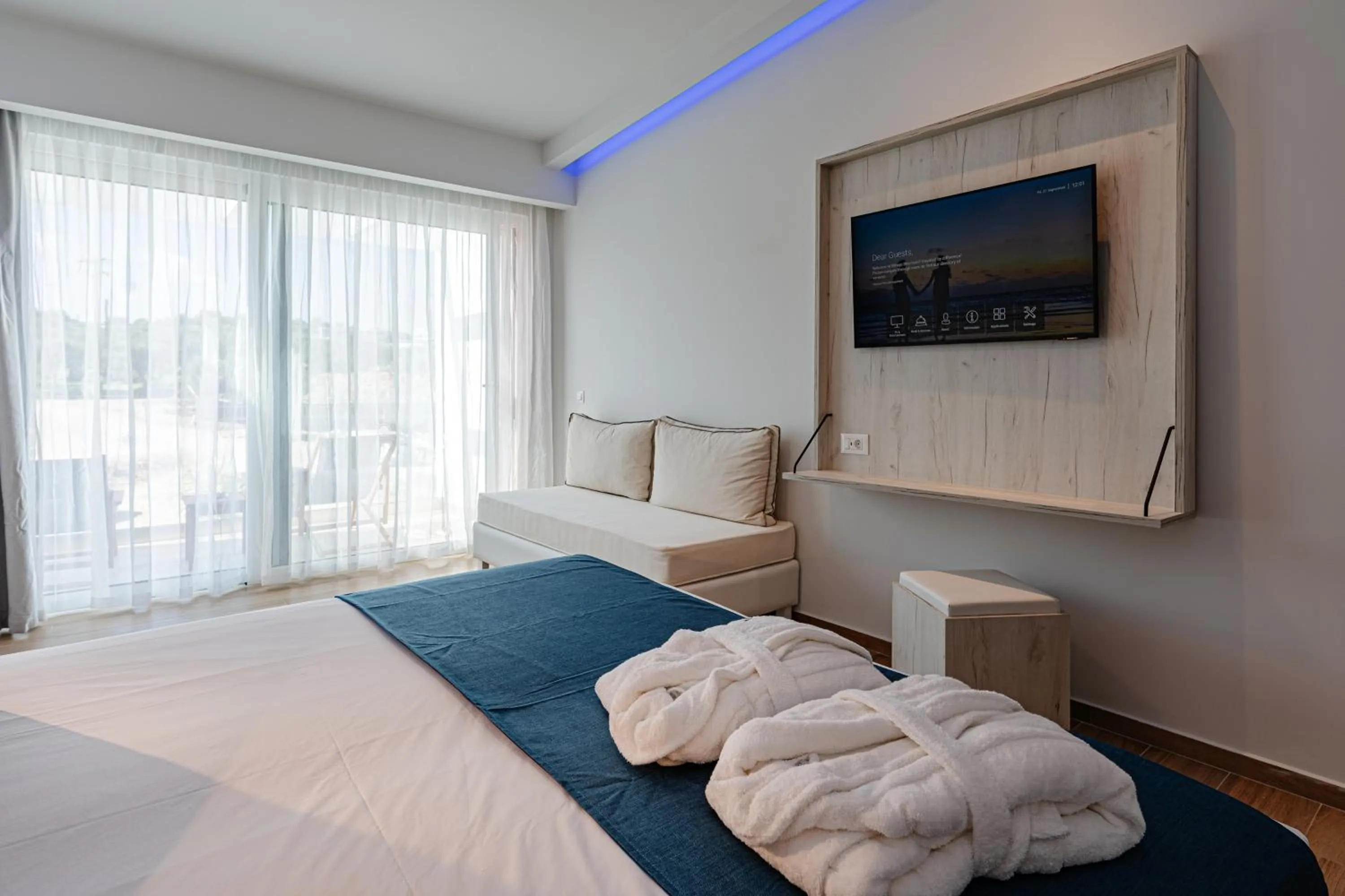 Bed in Magique Bleu Suites