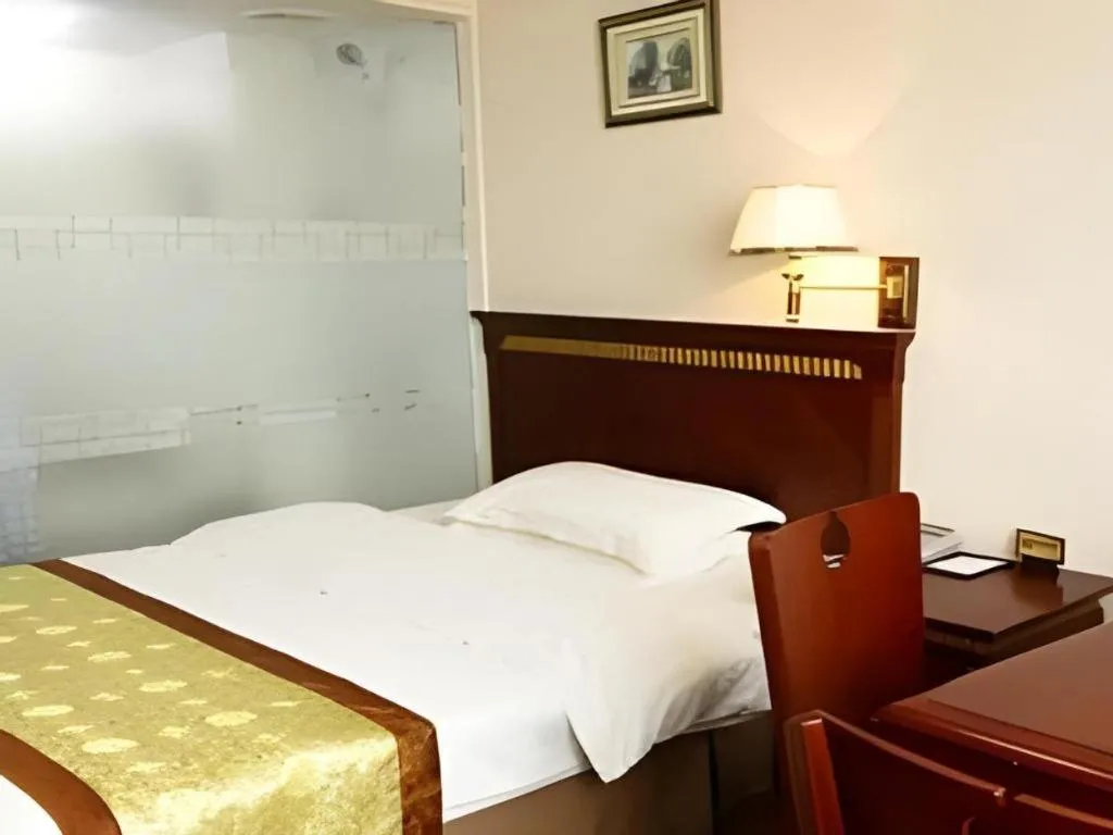 Bed in Nantong GuoDu Hotel