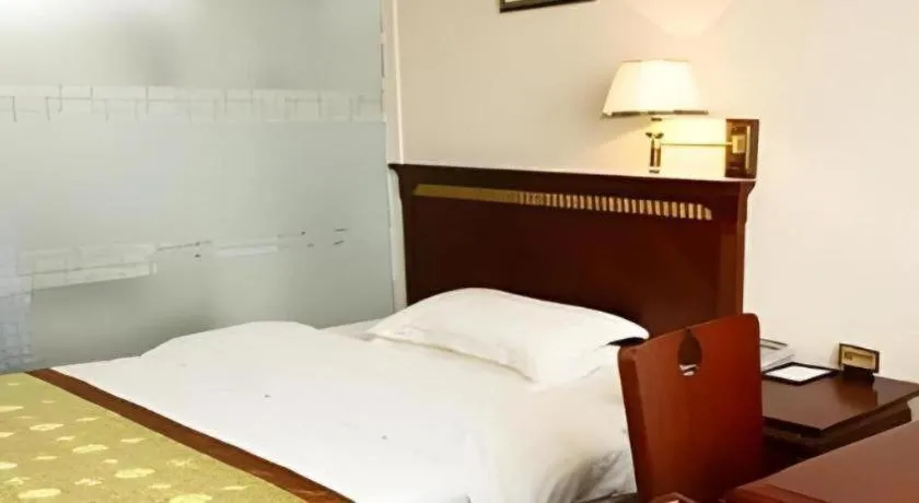 Bed in Nantong GuoDu Hotel