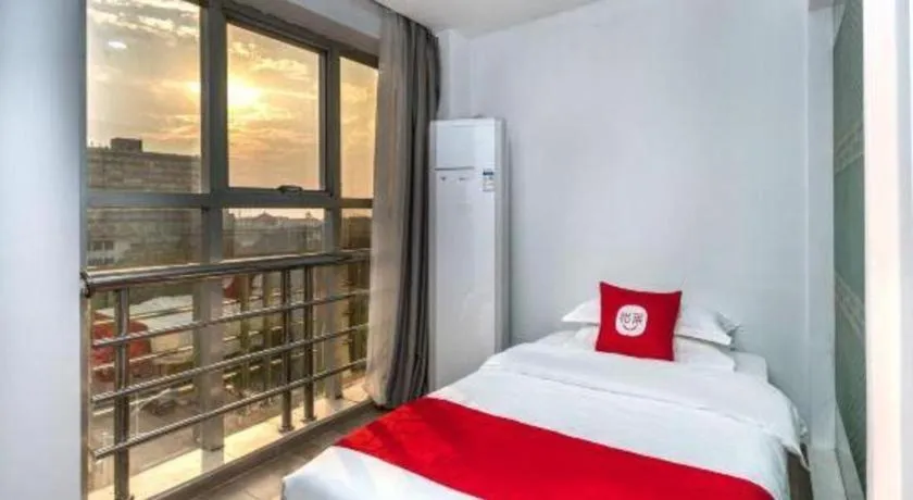 Bed in Nantong GuoDu Hotel