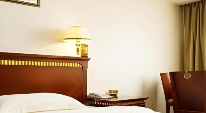 Bed in Nantong GuoDu Hotel