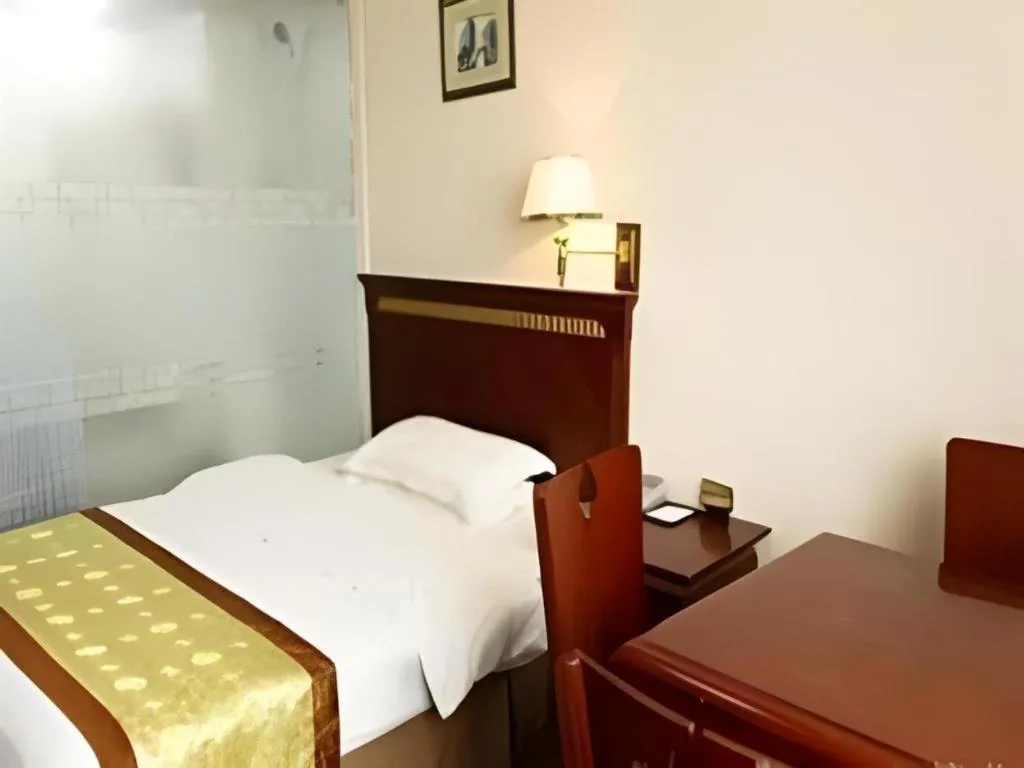 Bed in Nantong GuoDu Hotel