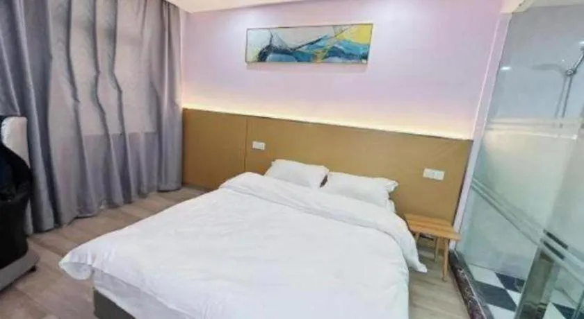 Bed in Nantong GuoDu Hotel