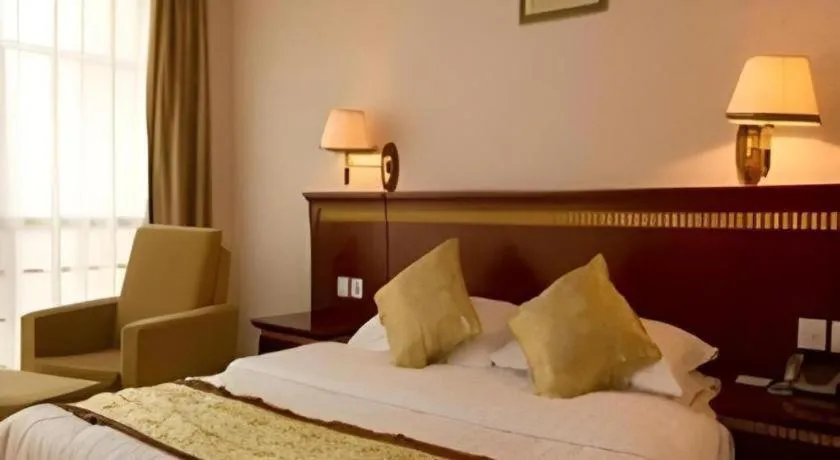 Bed in Nantong GuoDu Hotel