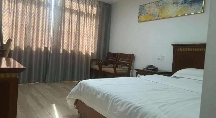 Bed in Nantong GuoDu Hotel