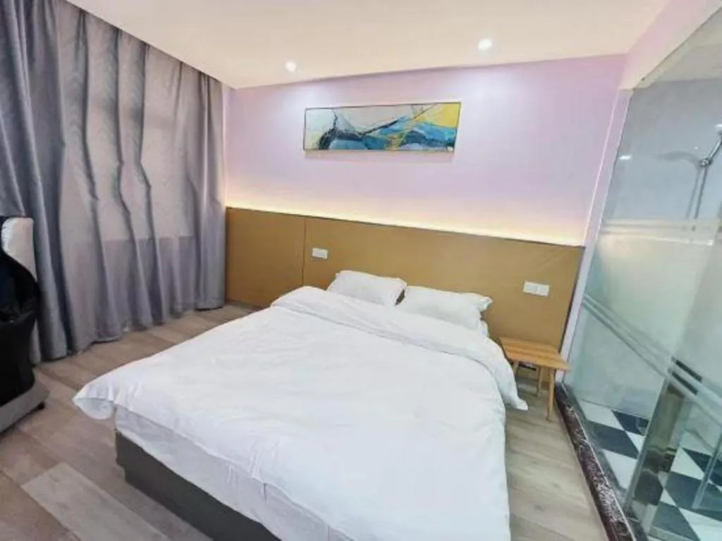 Bed in Nantong GuoDu Hotel