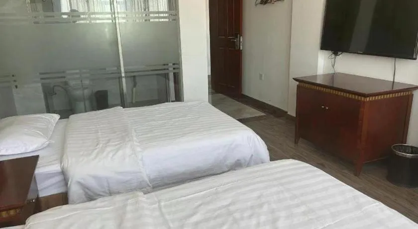 Bed in Nantong GuoDu Hotel