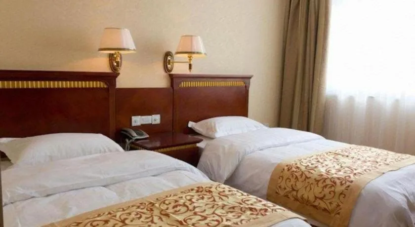 Bed in Nantong GuoDu Hotel