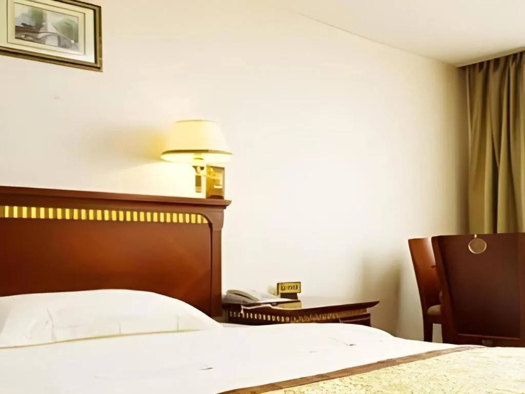 Bed in Nantong GuoDu Hotel