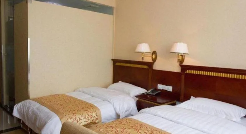 Bed in Nantong GuoDu Hotel