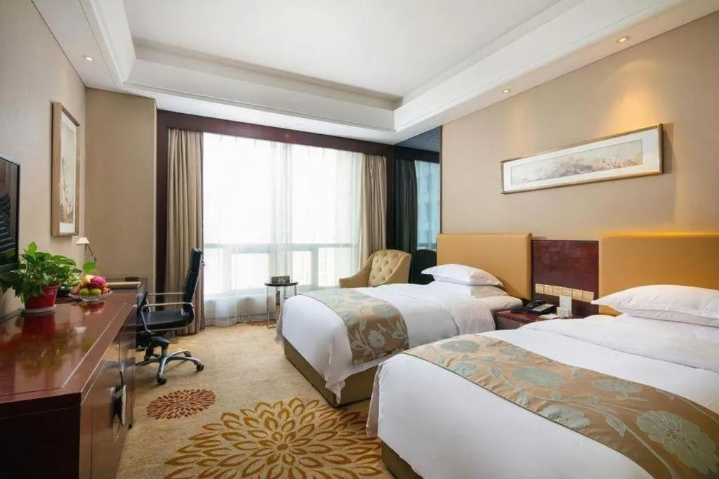 Bed in Zhengzhou Swan City International Hotel