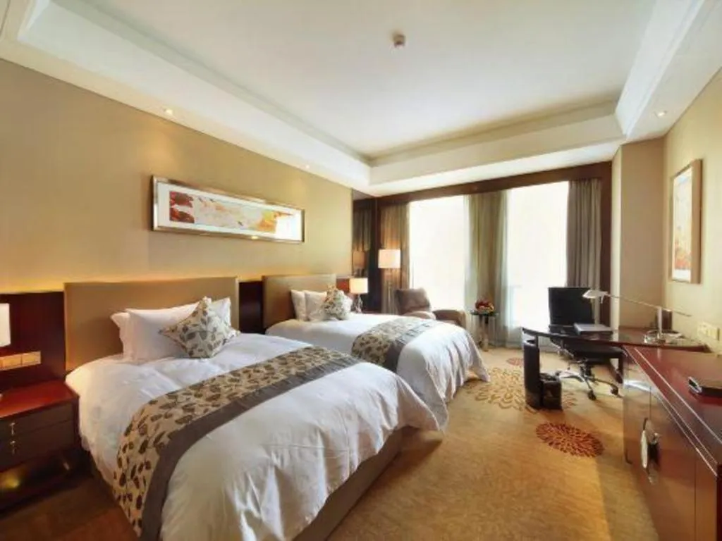 Bed in Zhengzhou Swan City International Hotel