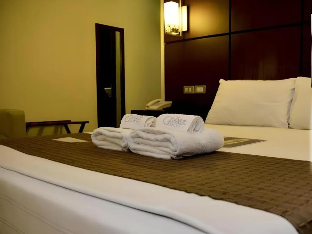 Bed in The Grande Suites