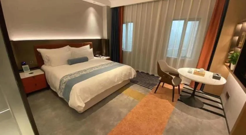Bed in Ningbo East Shipu Hotel