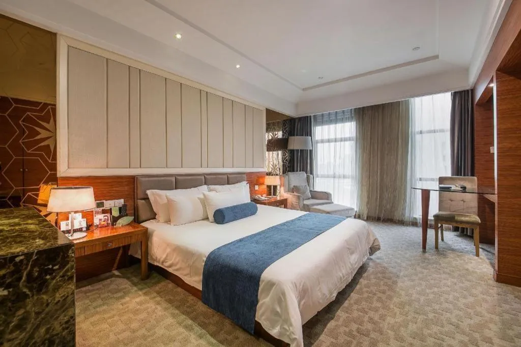 Bed in Ningbo East Shipu Hotel