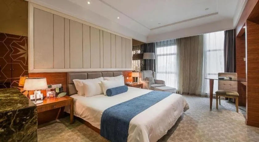 Bed in Ningbo East Shipu Hotel