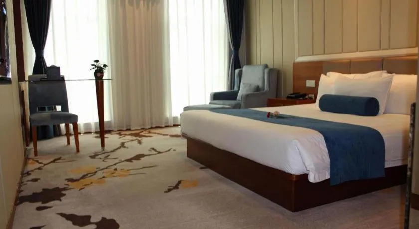 Bed in Ningbo East Shipu Hotel