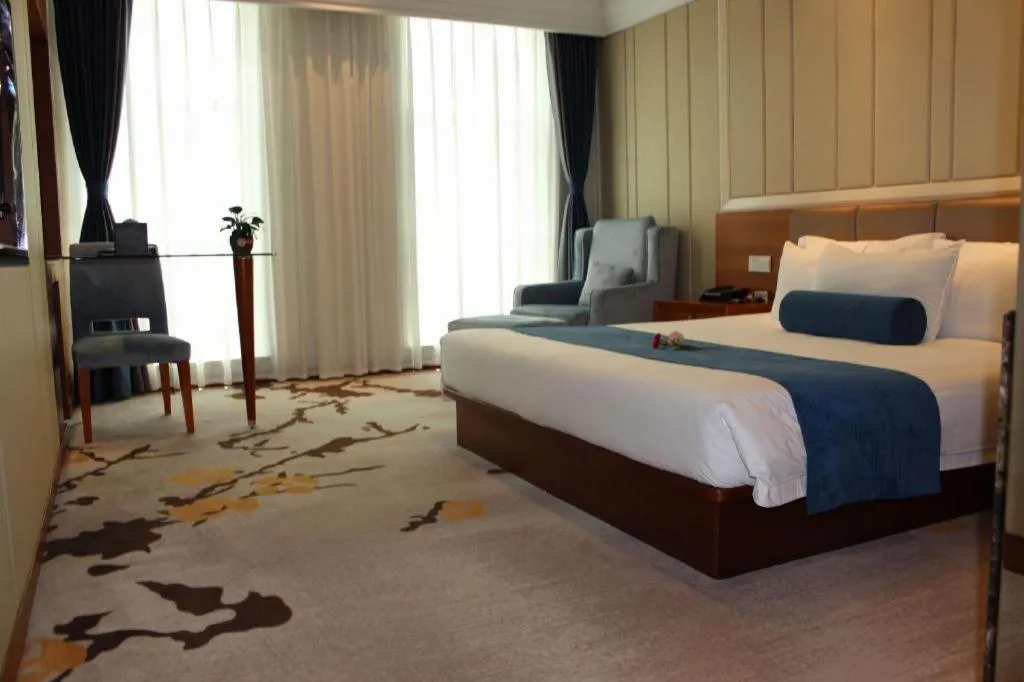 Bed in Ningbo East Shipu Hotel