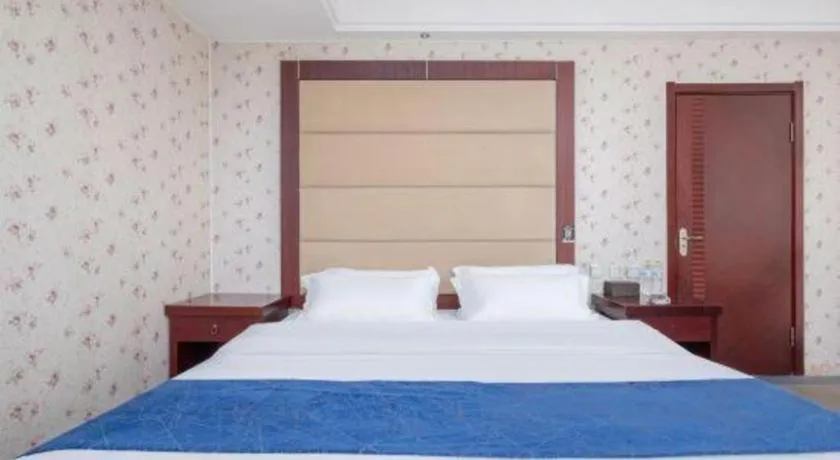 Bed in Weihai Huayu Business Hotel