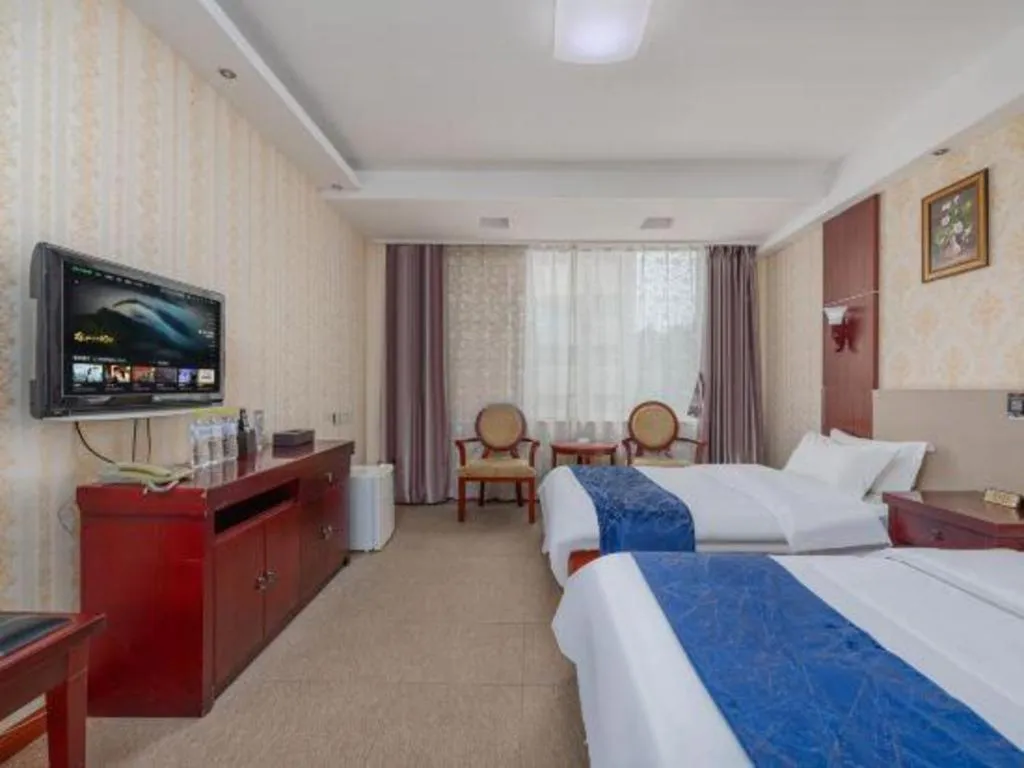 Bed in Weihai Huayu Business Hotel