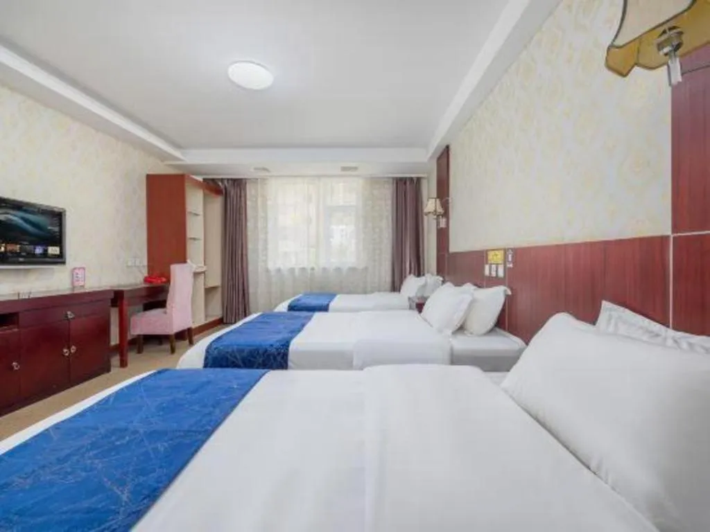 Bed in Weihai Huayu Business Hotel