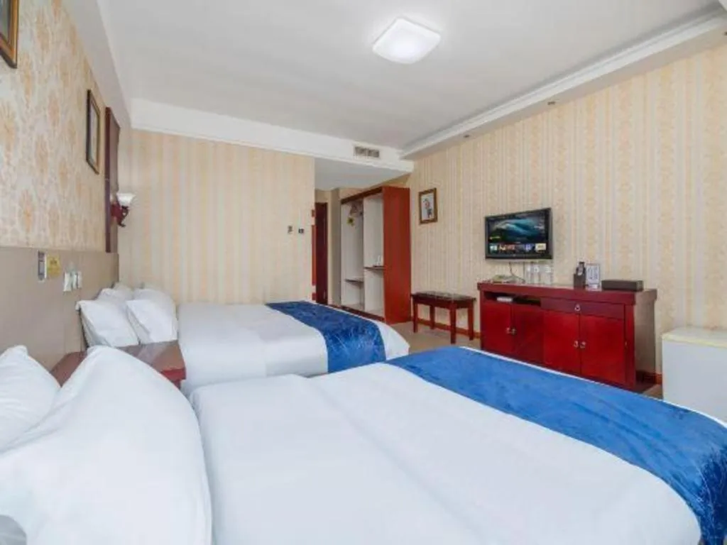Bed in Weihai Huayu Business Hotel