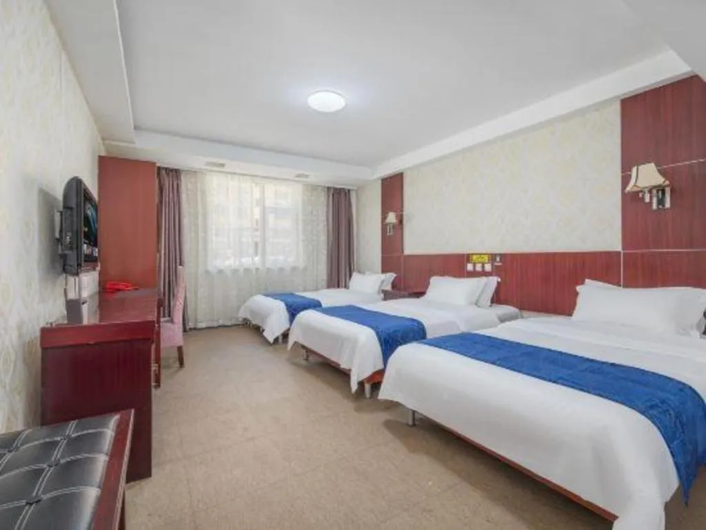 Bed in Weihai Huayu Business Hotel