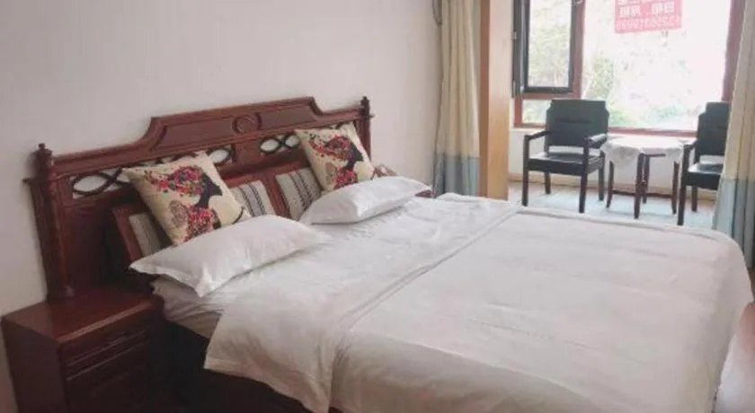 Bed in Weihai Huayu Business Hotel