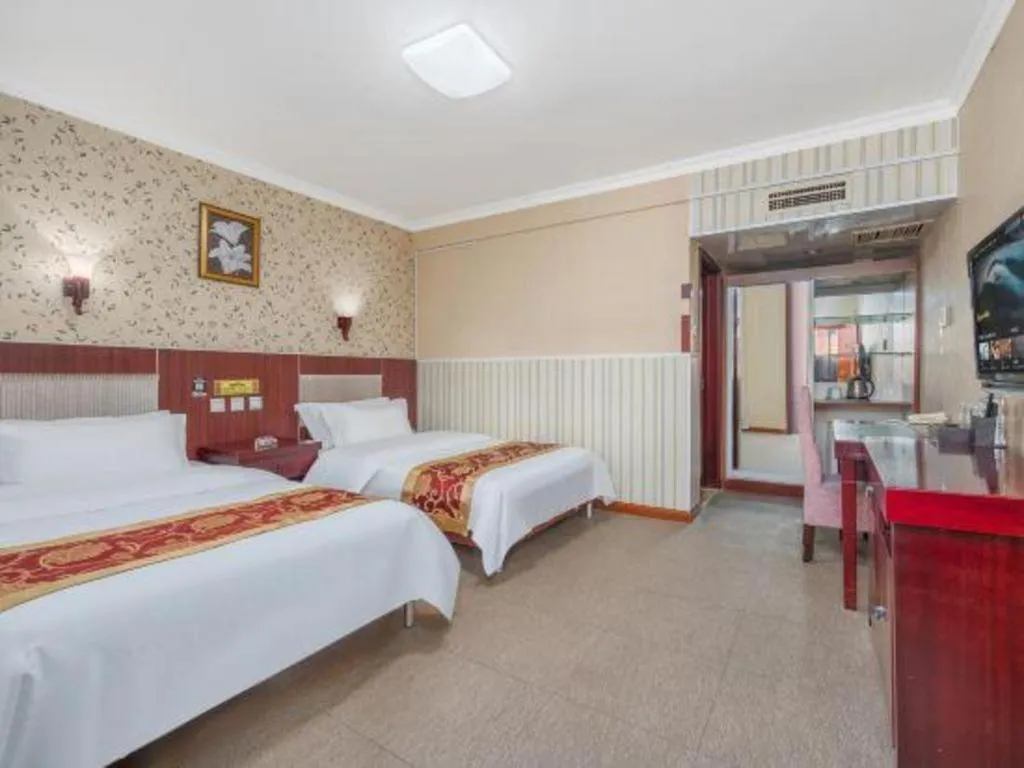 Bed in Weihai Huayu Business Hotel