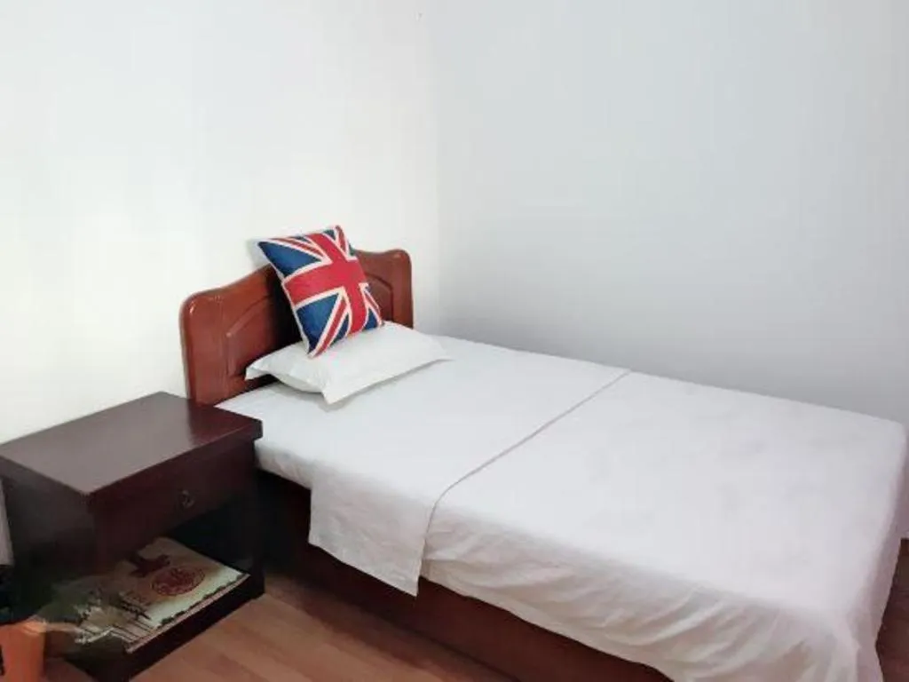 Bed in Weihai Huayu Business Hotel