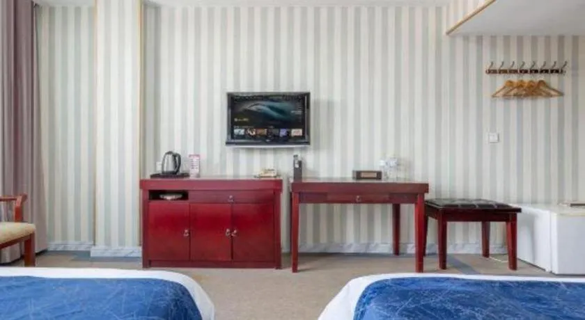 Bed in Weihai Huayu Business Hotel