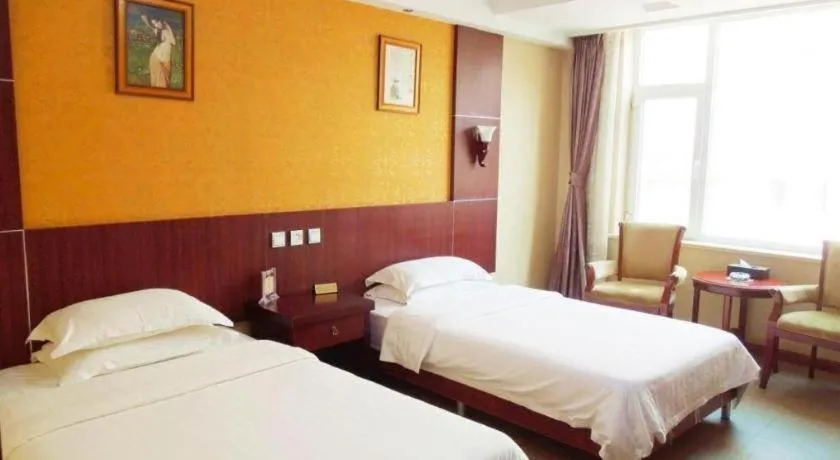 Bed in Weihai Huayu Business Hotel