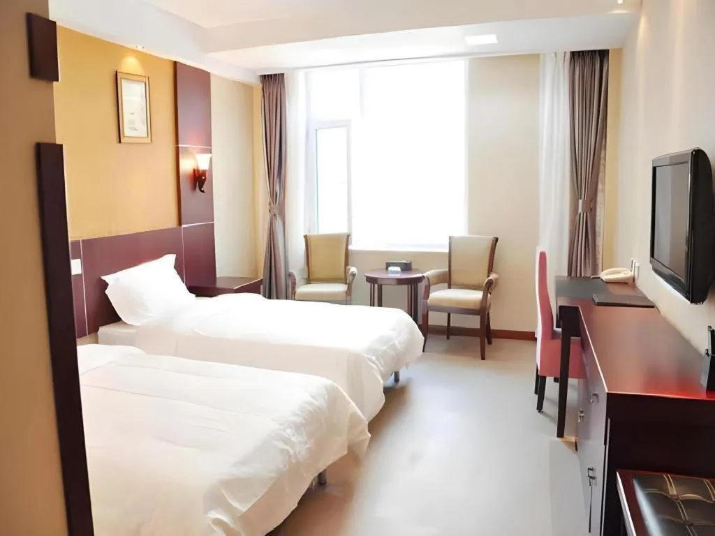 Bed in Weihai Huayu Business Hotel