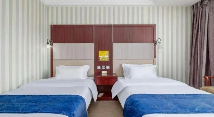 Bed in Weihai Huayu Business Hotel