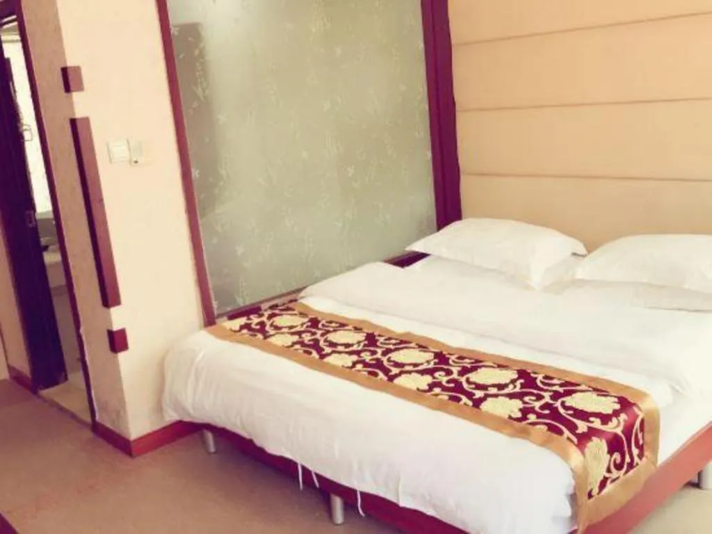 Bed in Weihai Huayu Business Hotel
