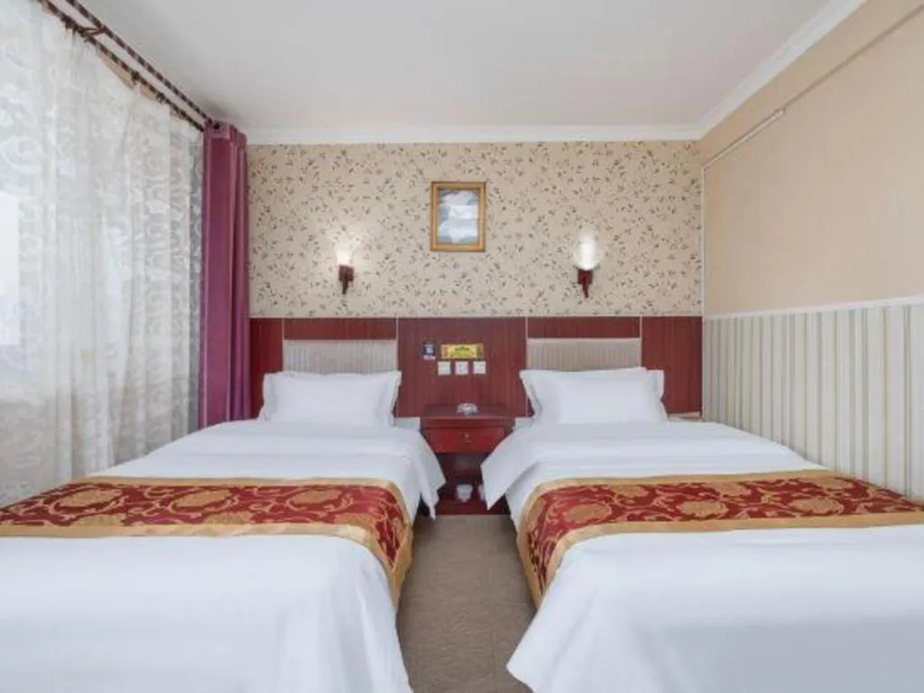 Bed in Weihai Huayu Business Hotel