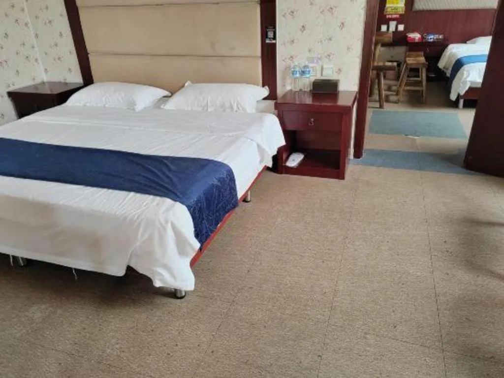 Bed in Weihai Huayu Business Hotel