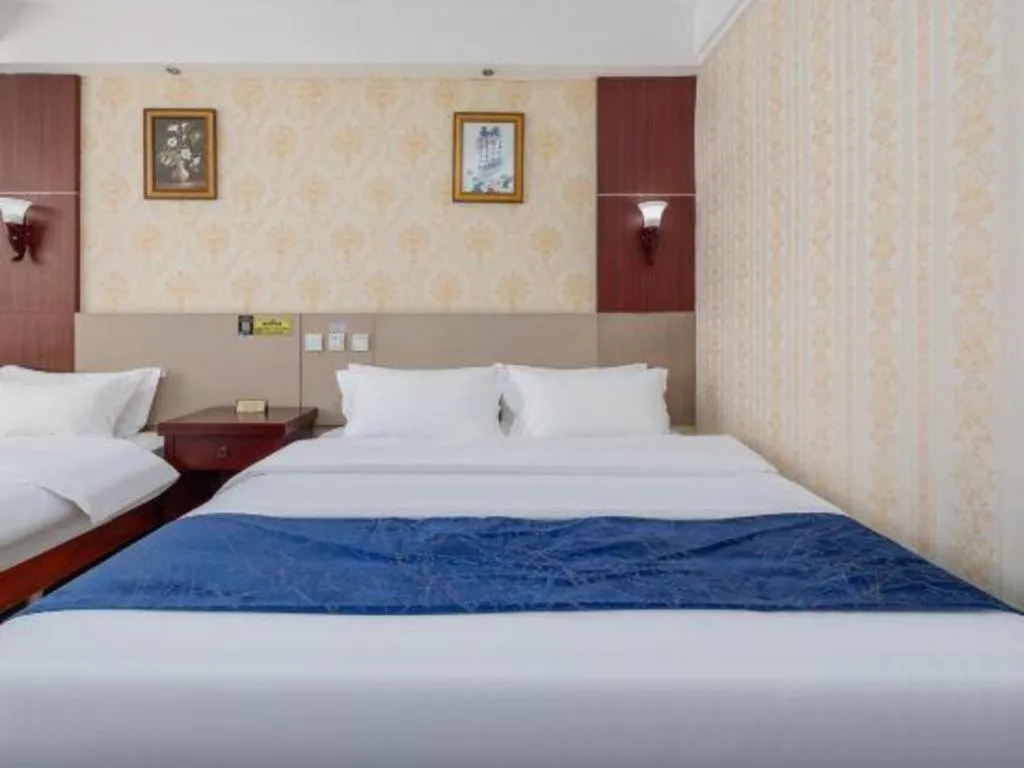 Bed in Weihai Huayu Business Hotel
