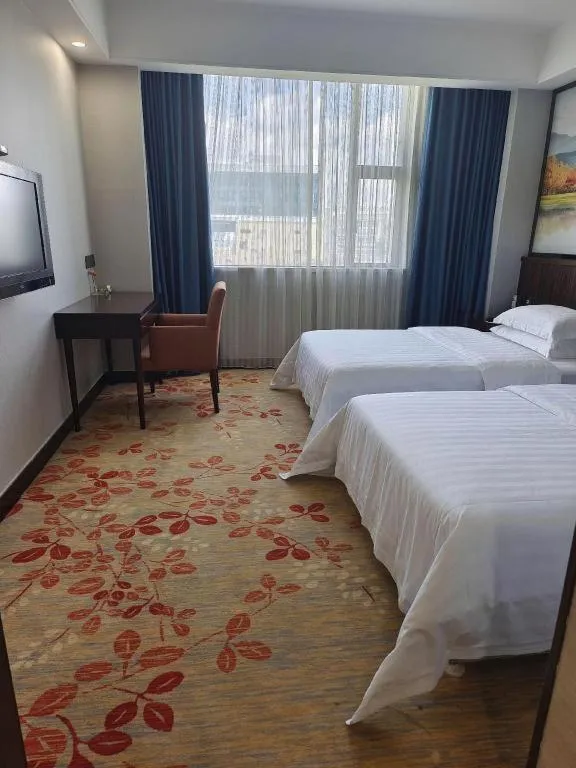 Bed in Centenio International Hotel