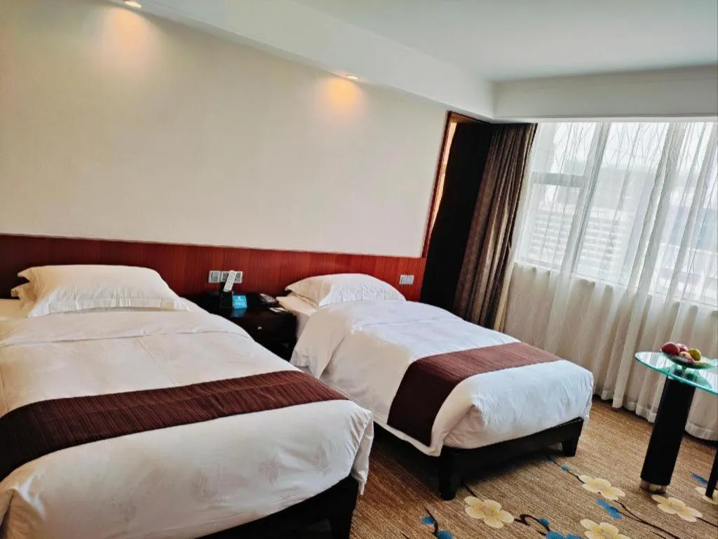 Bed in Centenio International Hotel