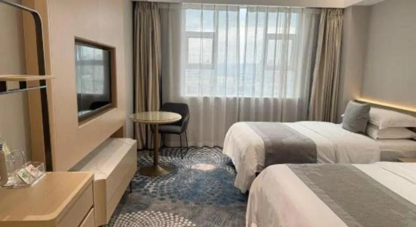 Bed in Kunming Zhong Huang Hotel