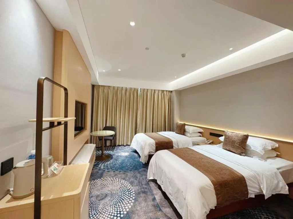 Bed in Kunming Zhong Huang Hotel